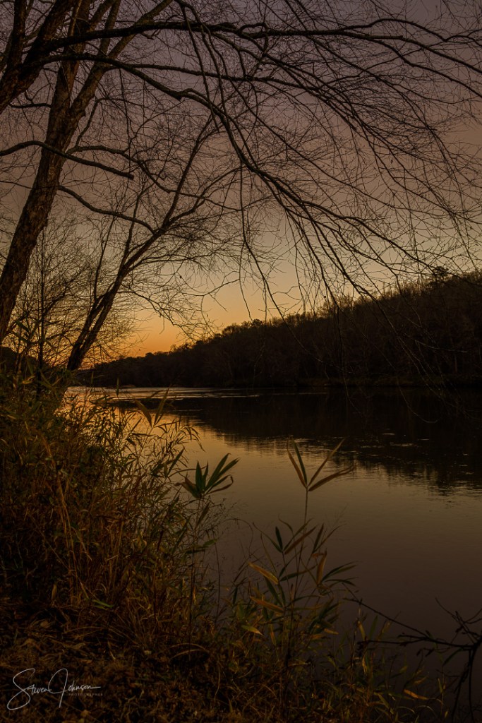 Dusk view of mountains and trees on the Flint River in Upson County, GA